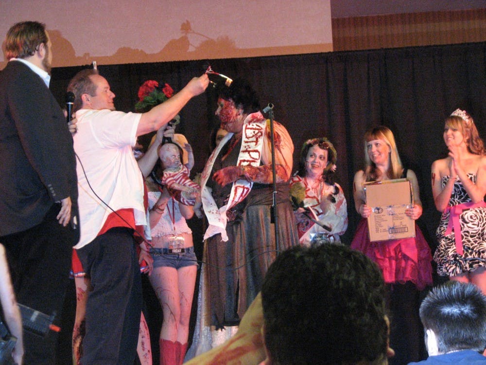 LIVING DEAD: Attendees of the annual Phoenix Comic-Con participate in the "Zombie Beauty Pagaent," a competition where participants dress as zombies, perform acts and respond to questions asked by a panel of judges. (Photo by Travis McKnight)
