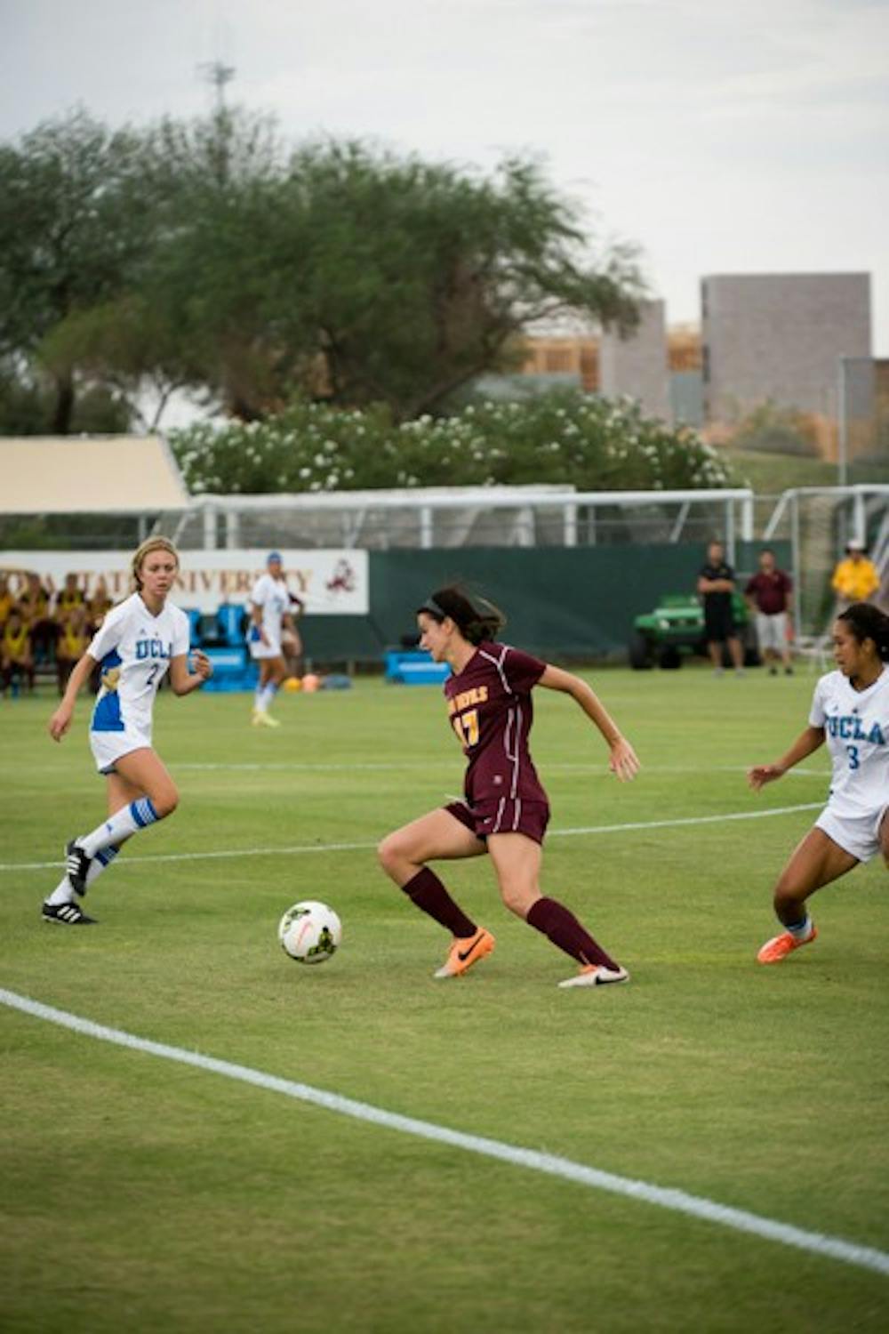 Junior forward Cali Farquharson moves the ball downfield against UCLA on Sept. 26. in Tempe. (Photo by Andrew Ybanez)