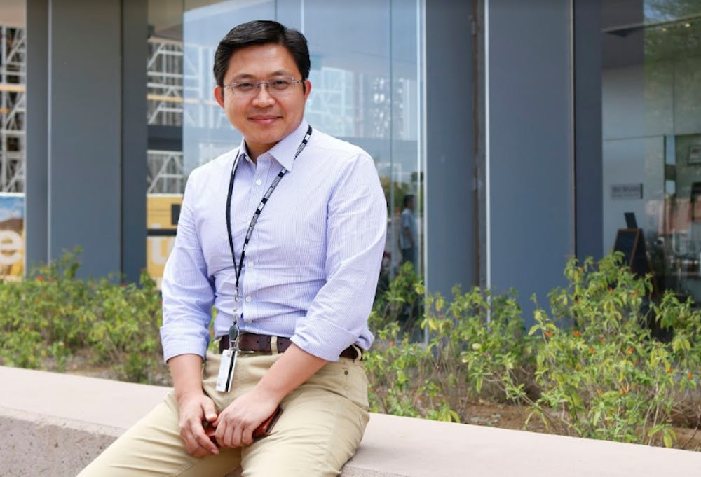 ASU biomedical engineering professor Ye Hu poses for a photo outside the biodesign building on ASU's Tempe campus on Thursday, April 13, 2017.