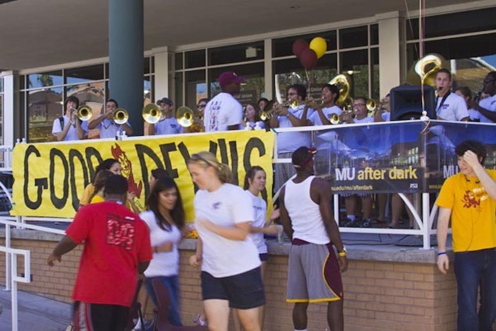 A PEPPY TUNE: An ASU pep squad plays music and games in front of the MU at the Tempe campus Thursday afternoon to get students fired up for this weekend's athletics events. (Photo by Annie Wechter)