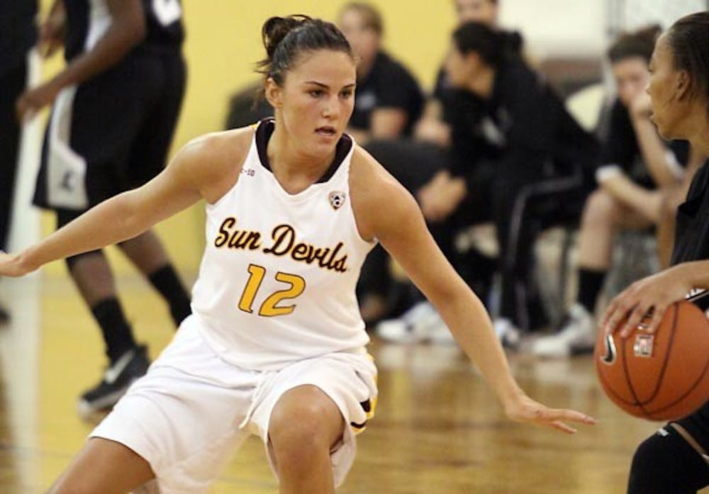 DEFENSIVE STANCE: Junior guard Alex Earl gets in position to guard a Providence ballhandler during ASU's 63-56 victory over the Friars. The Sun Devils turned up the intensity in practice this week in preparation for the ASU Classic. (Photo Courtesy of Steve Rodriguez)