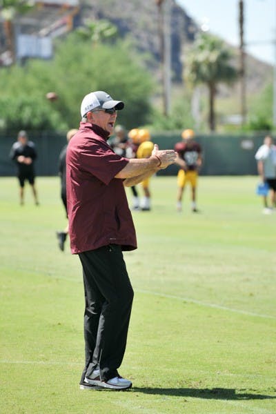ASU football coach Todd Graham calls for a wedge formation at a practice in Tempe. ASU football is set to play Weber State for their first game of the 2014 season on Aug. 28 2014. (Photo by Andrew Ybanez)