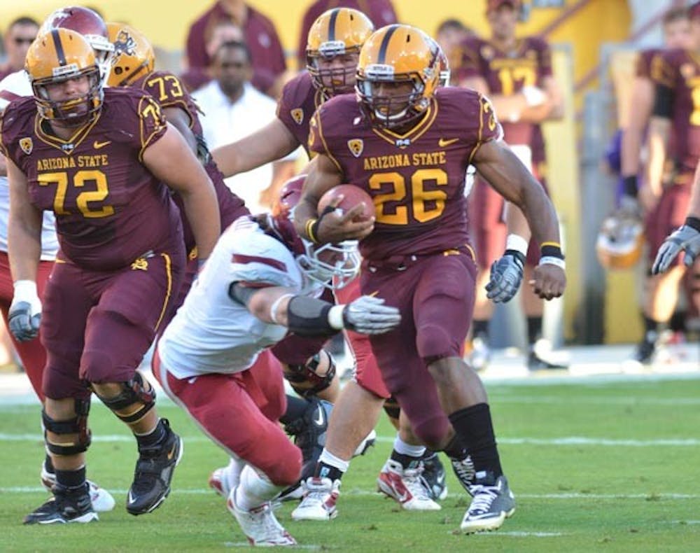 MARSHALL LAW: Sophomore running back Cameron Marshall runs through a Washington State defender during ASU’s 42-0 win last Saturday. The Sun Devils travel to Los Angeles on Saturday in hopes of beating USC for the first time since Nov. 6, 1999. (Photo by Aaron Lavinsky)