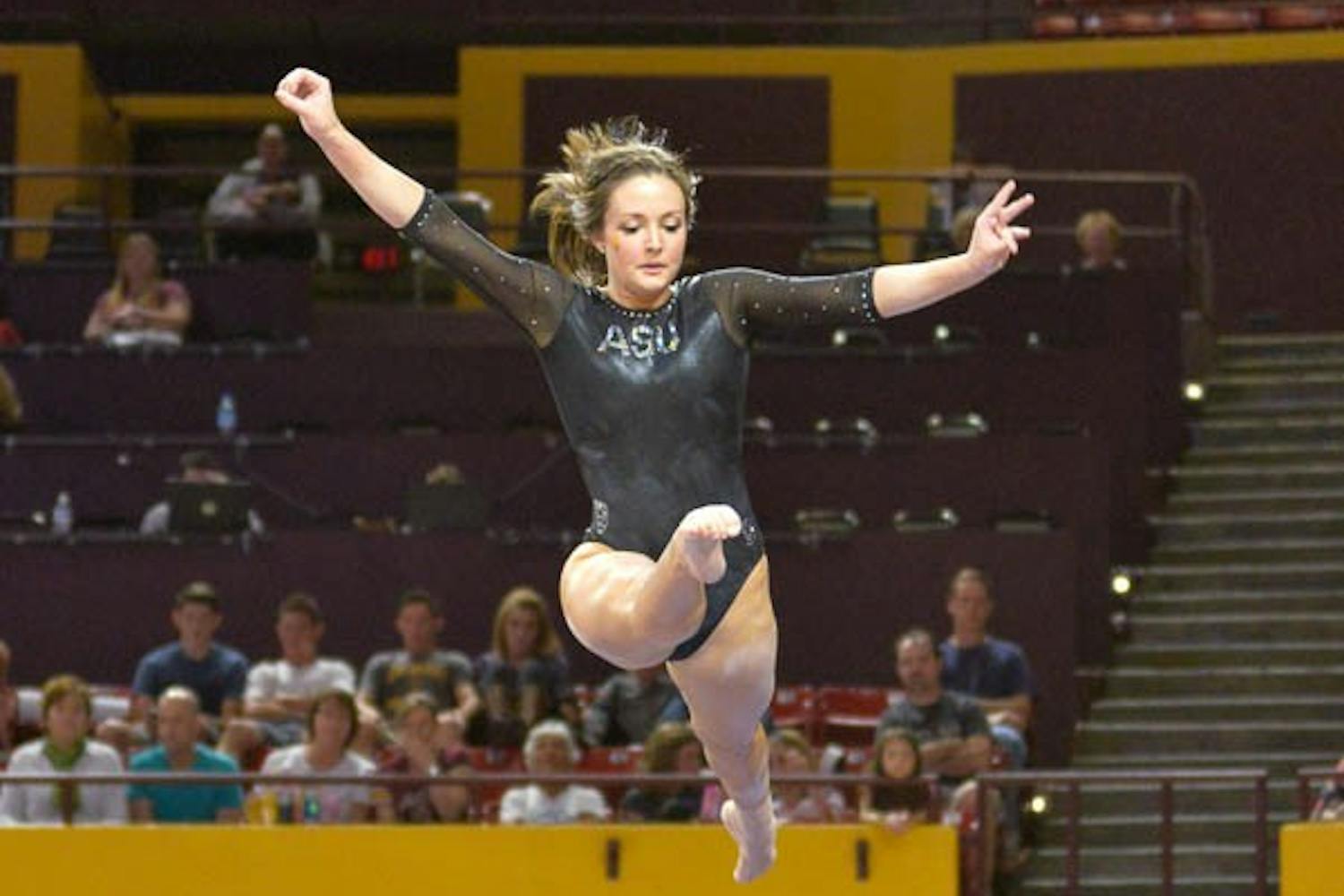 Senior Brianna Gades on the balance beam March 13, 2015 at the Wells Fargo Arena in Tempe. (J. Bauer-Leffler/The State Press)