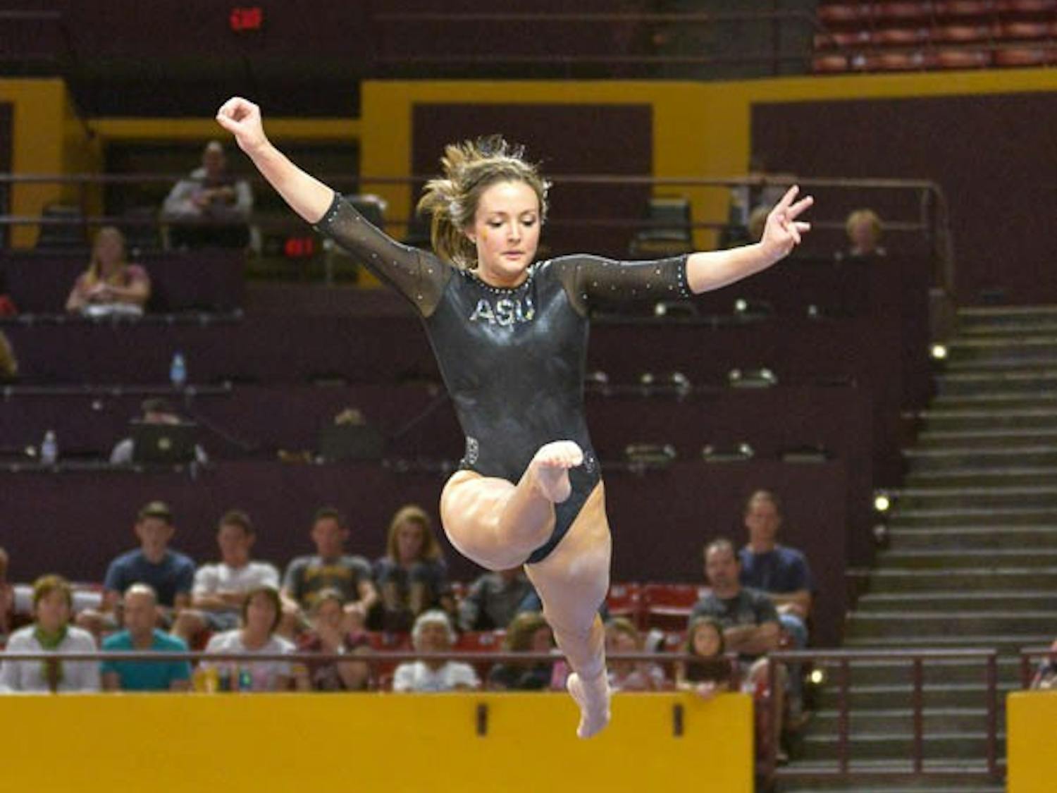 Senior Brianna Gades on the balance beam March 13, 2015 at the Wells Fargo Arena in Tempe. (J. Bauer-Leffler/The State Press)