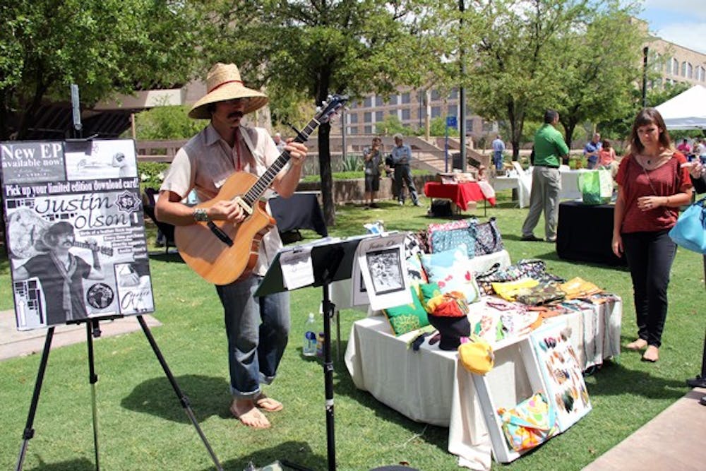 Justin Olson performs at the Green Business Expo in Tempe on Wednesday morning. (Photo by Diana Lustig)