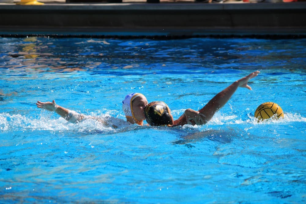 ASU sophomore Bente Rogge (12) attempts to save the ball from a UCSB player during a game at Mona Plummer Aquatic Center in Tempe, Arizona, on Sunday, Jan. 29, 2017.