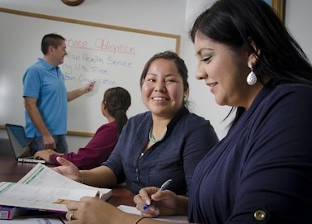 ASUN student Venassa Yazzie studies with Yomahira Villalobos, a student and ASUN administrative associate.
(Photo courtesy of Dave Tevis)