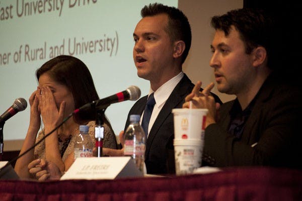 Liberal Ana Kasparian puts her hands to her face in frustration while Liberatarian Austin Peterson speaks about outsourcing jobs to China and corporate tax rates. Kasparian, Peterson and conservative stand-in  J.P. Freire debated in the Memorial Union Wednesday evening. (Photo by Danielle Gregory) 