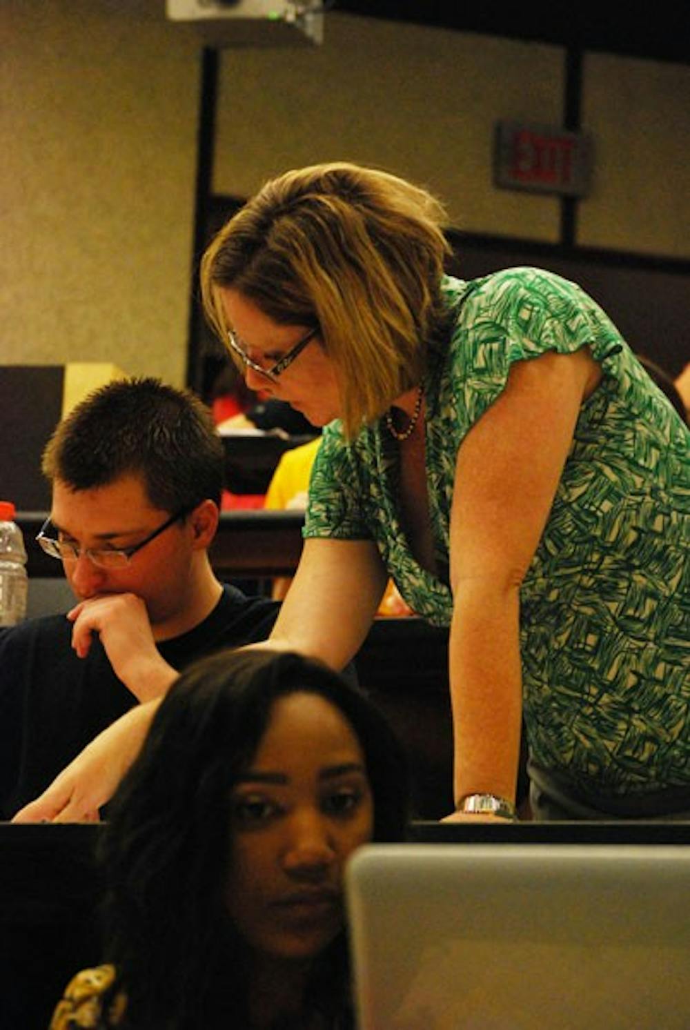 Professor Kelli Gamez Warble explains how to calculate slope and constants to her Fundamentals of Physical Science class on Tuesday morning. (Photo by Murphy Bannerman)