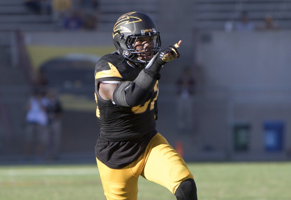 Redshirt senior linebacker Antonio Longino (32) reacts after a play in the third quarter against Washington on Saturday, Nov. 14, 2015, at Sun Devil Stadium in Tempe. The Sun Devils defeated the Huskies 27-17.  