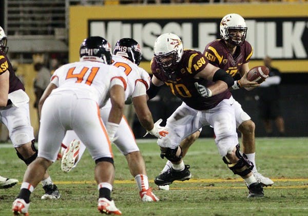 ROAD WORK: Junior quarterback Brock Osweiler prepares to hand the ball off to junior running back Cameron Marshall during the Sun Devils’ 35-20 win over Oregon State. The Sun Devils look to get their first road win at Rice-Eccles Stadium against Utah on Saturday. (Photo by Beth Easterbrook)