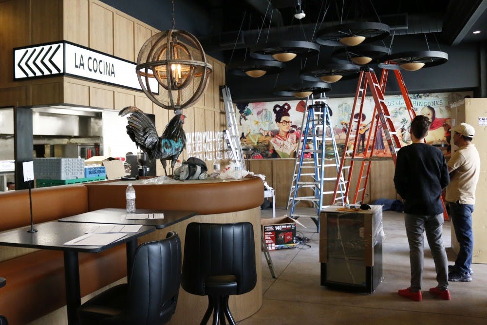 People work on setting upt the interior of new restaurant Chico Malo at City Scape near ASU’s downtown campus in Phoenix, Arizona pictured on Saturday, April 1, 2017.