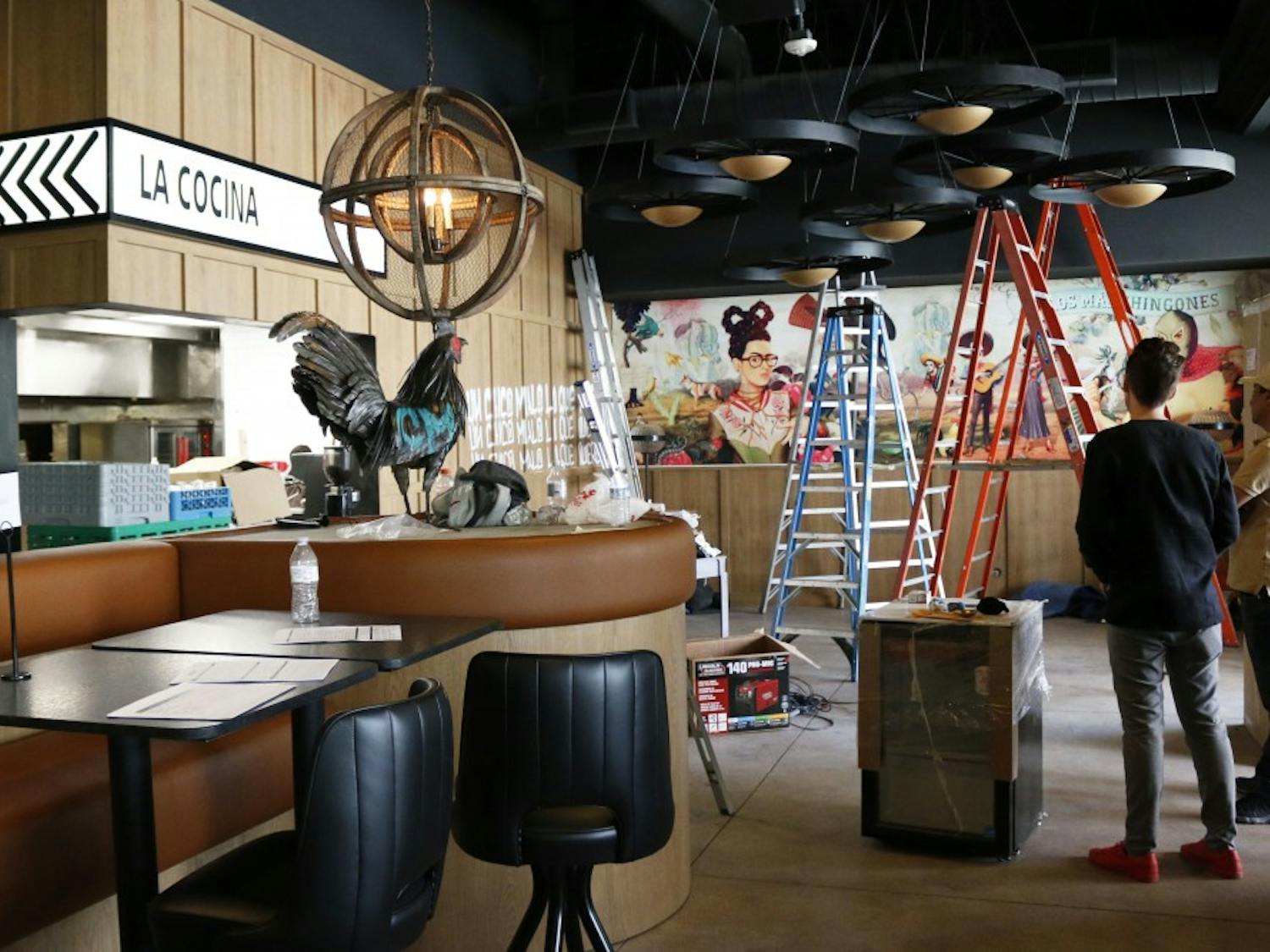 People work on setting upt the interior of new restaurant Chico Malo at City Scape near ASU’s downtown campus in Phoenix, Arizona pictured on Saturday, April 1, 2017.
