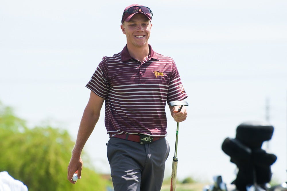 [year first name lastname] grins after sinking a putt in the Thunderbird Invitational tournament on Saturday, April 4, 2015 at Karsten Golf Course in Tempe. (Ben Moffat/The State Press)
