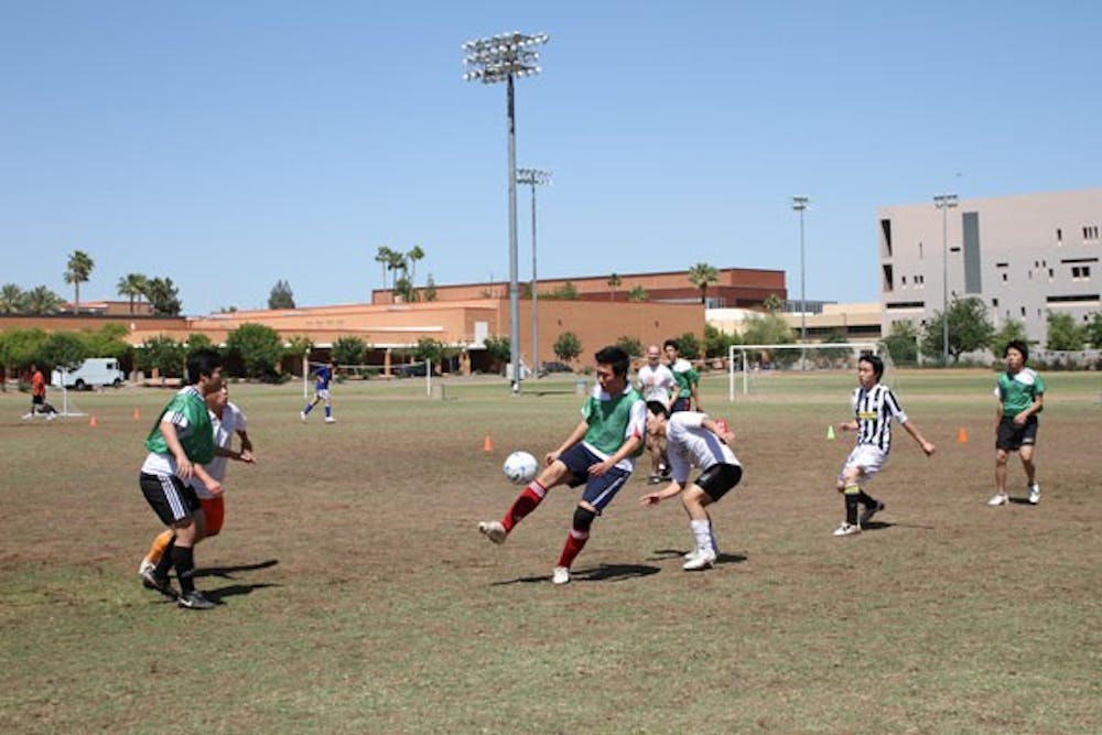 ASU OLYMPICS: Students from different parts of the world play soccer at the SRC field on Saturday afternoon as part of the olympic event hosted by the Coalition of International students over the weekend. (Photo by Nikolai de Vera)