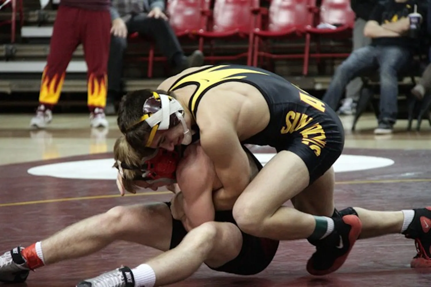 Nathan Hoffer grapples with an opponent in a meet against Stanford on Feb. 5. Hoffer is one of eight freshman expected to make some noise in the Pac-12 tournament this weekend in Boise, Idaho. (Photo courtesy of Jeremy Hawkes)