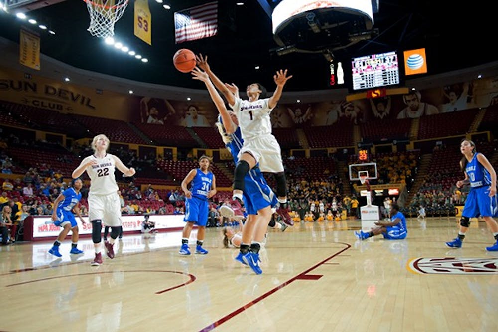 Junior guard Arnecia Hawkins attempts a layup in a game against Middle Tennessee, Friday. Nov. 14, 2014 at Wells Fargo Arena in Tempe. ASU hosts No. 12 Stanford this weekend. (Photo by Ben Moffat)