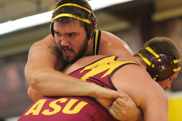 Redshirt senior heavyweight wrestler Levi Cooper won 3-0 against Nebraska redshirt freshman Danny Longendyke, but it wasn’t enough to help the Sun Devils defeat the Cornhuskers on Saturday. (Photo by Kyle Newman)