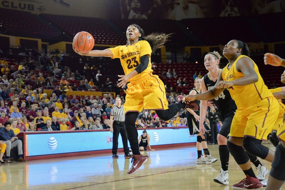 ASU junior Sun Devil Elisha Davis stretches for another Sun Devil basket in the second half of Sunday's game. The Sun Devils won their 26th game on March 1, 2015, at the Wells Fargo Arena in Tempe. (J. Bauer-Leffler/The State Press)
