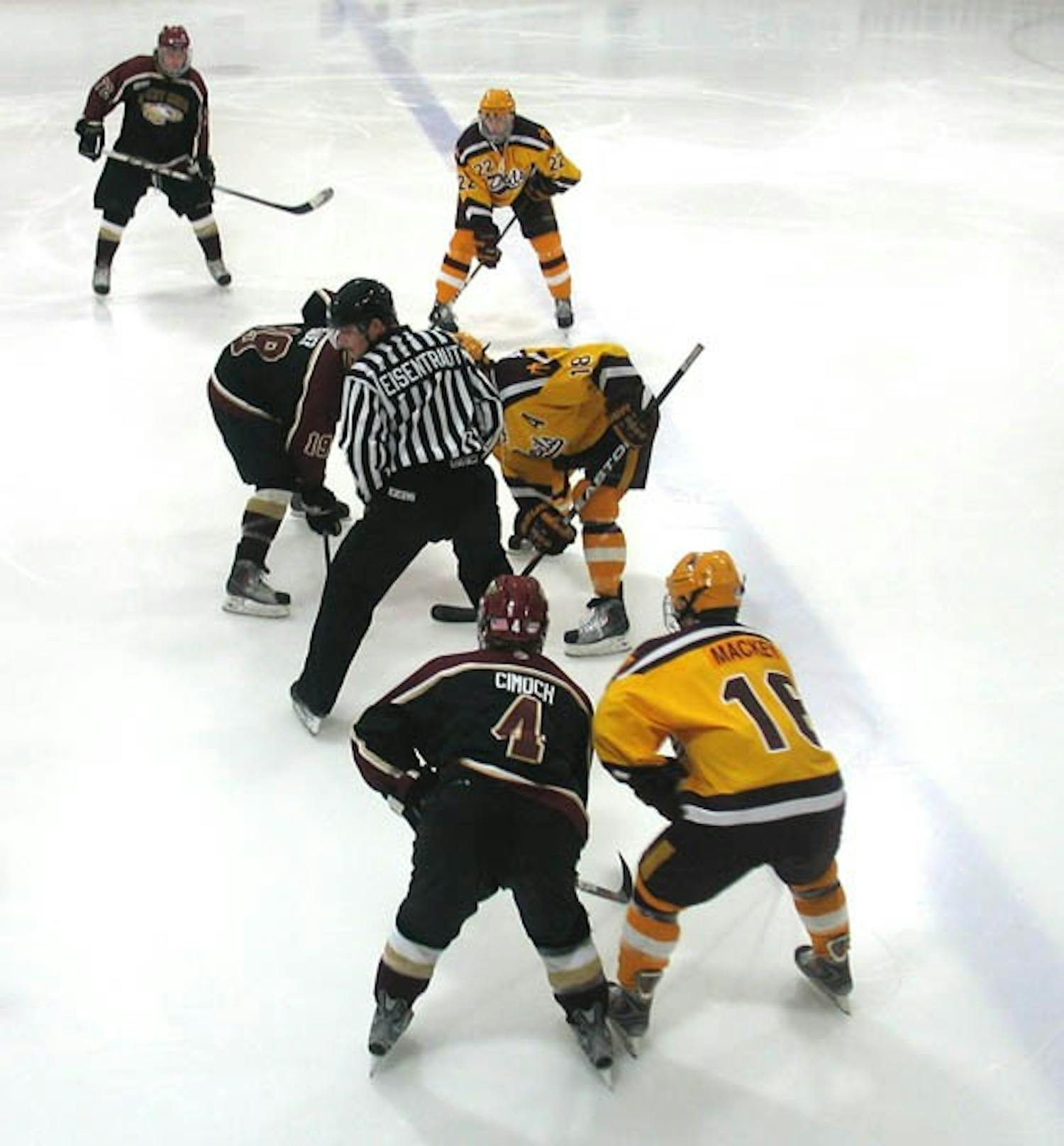 Face Off: ASU forward Chris Vassos waits for the puck to drop against Robert Morris forward Dave Bauer. The Sun Devils split the weekend series against the Eagles, with both games reaching overtime. (Photo Courtesy of Edmund Hubbard)