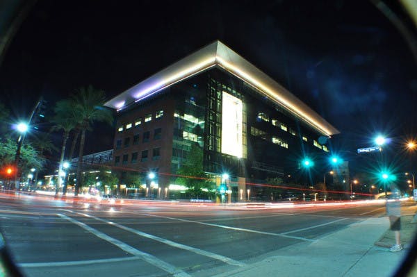 Cars zoom past the ASU Fulton Center on University Drive on a chilly November night. (Photo courtesy of Luke Jarvie)