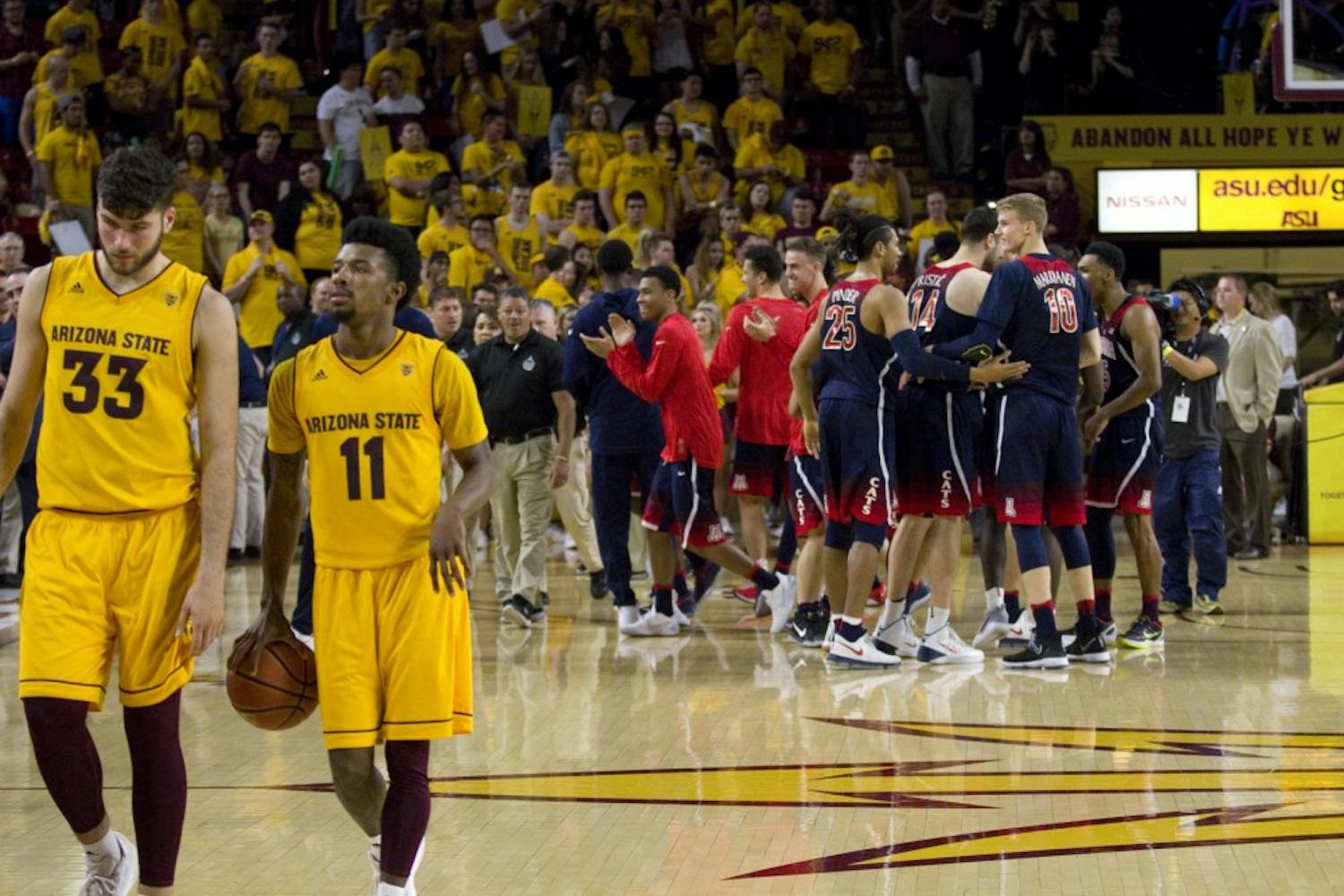 The Arizona Wildcats men's basketball team celebrates after defeating the ASU men's basketball team in Wells Fargo Arena in Tempe, Arizona on Saturday, March 4, 2017. ASU lost 73-60. 
