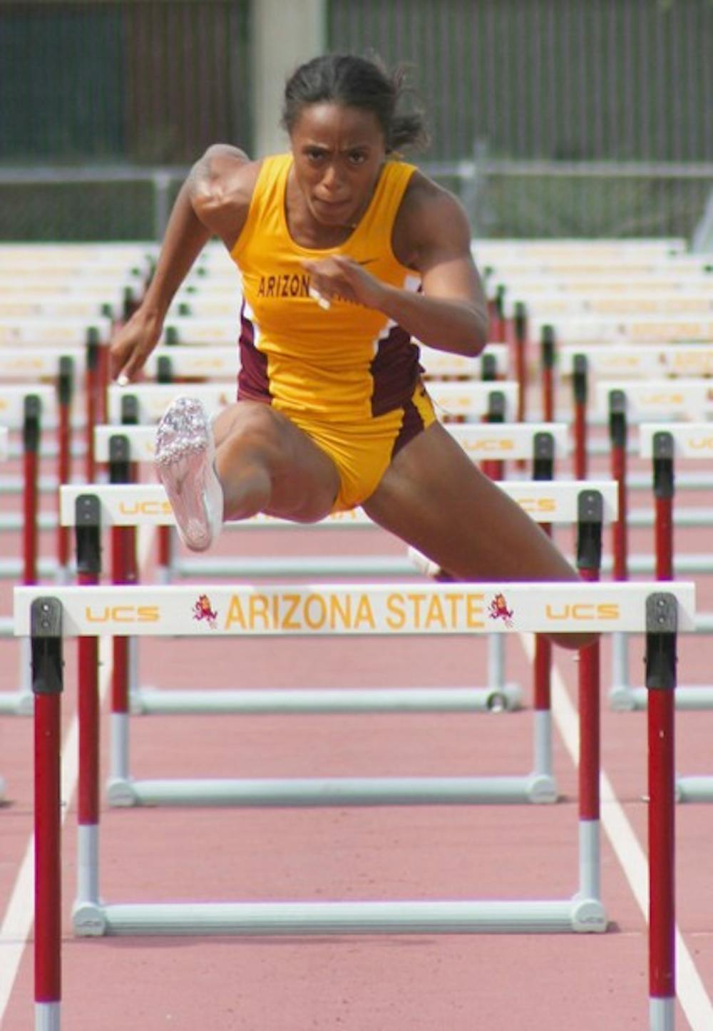 Team Leader: ASU senior Jasmine Chaney lunges over the hurdle during the 100-meter hurdles on Saturday in Tempe. She finished second in the race behind a runner for the Stellar Athletic Club. (Photo by Lisa Bartoli)