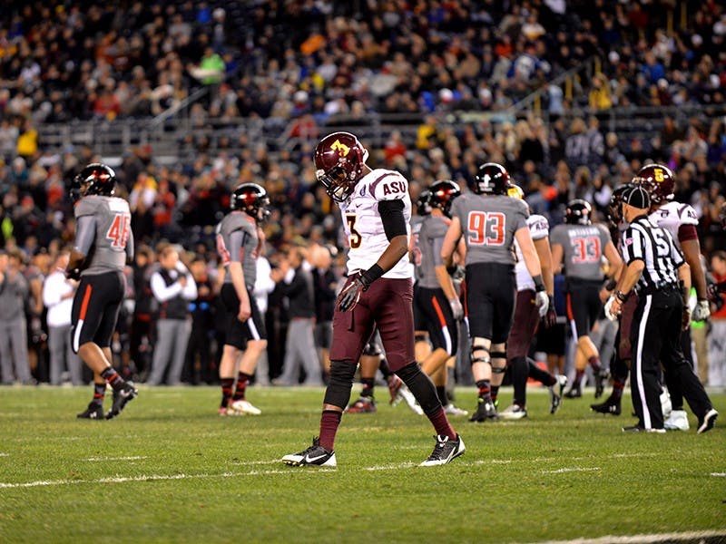 Redshirt junior defensive back Damarius Randall walks back to Sun Devil bench. ASU lost 37-23 to Texas Tech at the 2013 Holiday Bowl. (Photo by Andrew Ybanez)