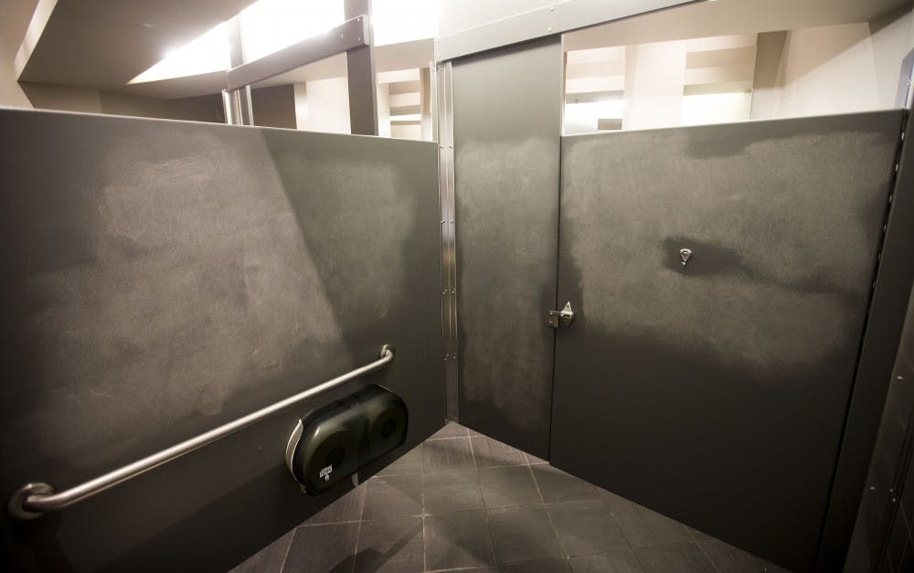 A freshly-cleaned bathroom stall in the Palo Verde East building is seen on Friday, Nov. 11, after a graphic message was allegedly written on the walls.