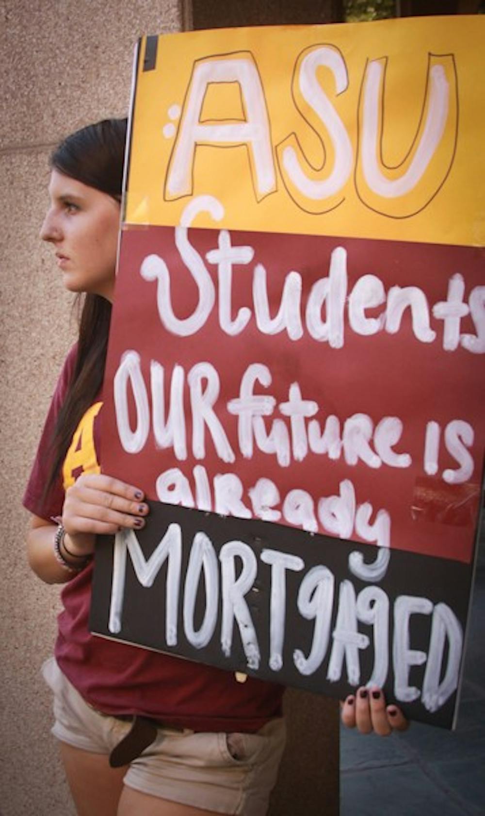 Graphic design freshman Andrea Seelye protests at "Occupy Phoenix" in downtown Phoenix. (Photo by Lillian Reid)