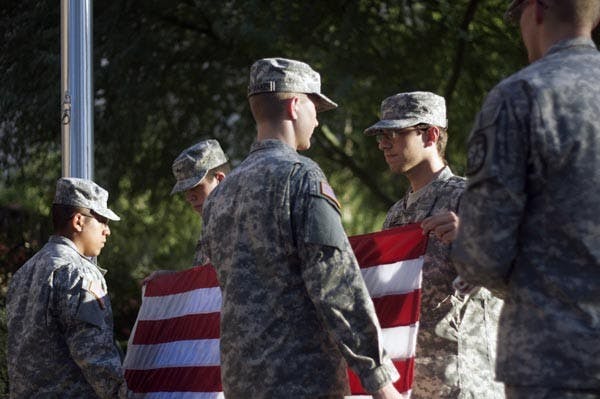 Members of the ROTC color guard take down the American flag in front of the Social Sciences building in Tempe, Arizona on Thursday, Oct. 14, 2010.