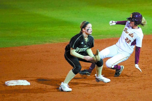 Behind the bag: ASU junior Taylor Haro slides behind a Western Michigan defender during the Sun Devils’ 17-0 victory on Feb. 10. Another five game weekend for ASU starts Friday against Seattle University. (Photo by Michael Arellano)