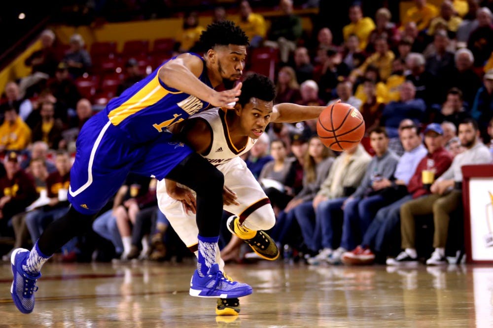 Sophomore guard Tra Holder (0) works against Cal State Bakersfield defense on Monday, Dec. 28, 2015, in Wells Fargo Arena. Arizona State went on to defeat CSUB 75-59. 