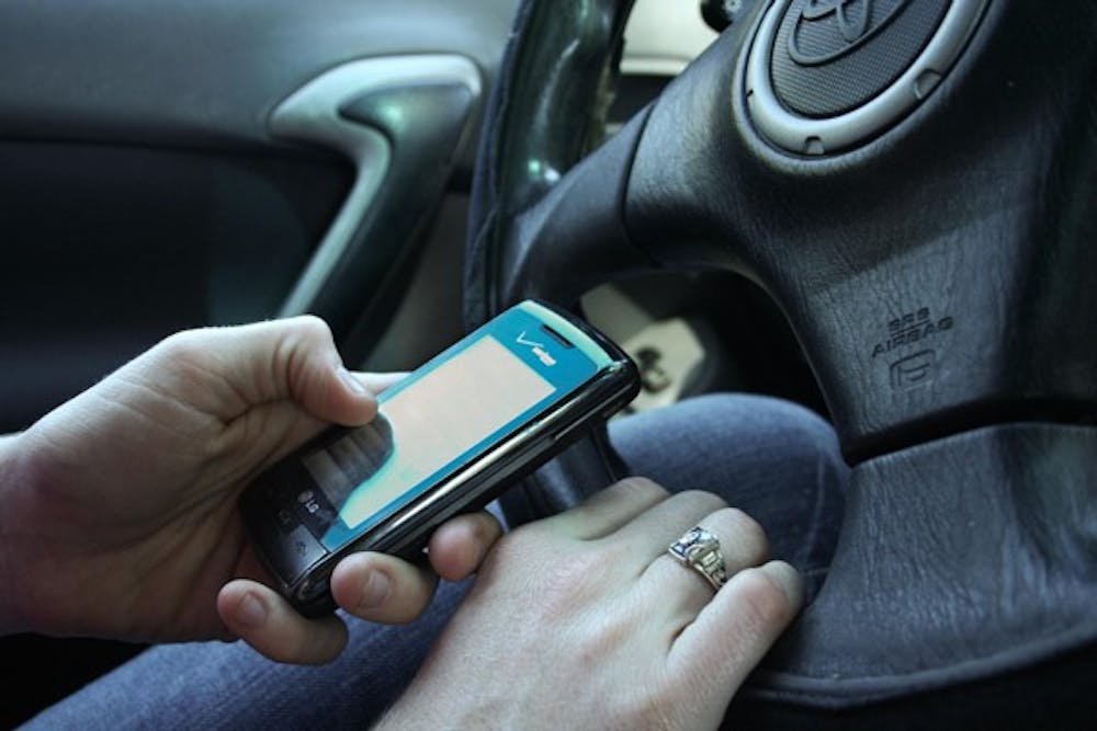 Recent Tempe ordinance creates fines of up to $500 for repeat offenses of using electronics while driving. (Photo illustration)
