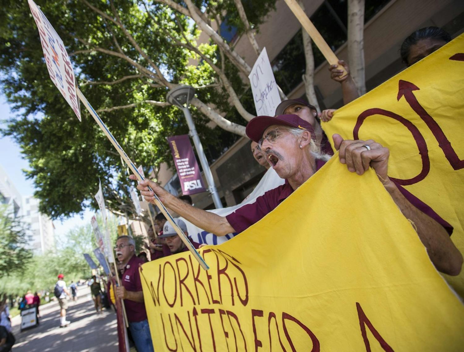 Olympus employees protest in Taylor Mall on the Downtown Phoenix campus on Thursday, Sept. 1, 2016. The employees were protesting unfair working conditions at Olympus, a company ASU contracts for janitorial services in buildings across campus. 