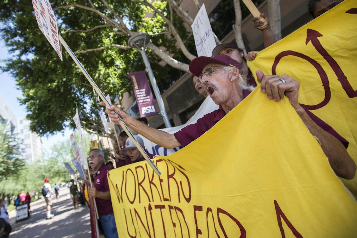 Olympus employees protest in Taylor Mall on the Downtown Phoenix campus on Thursday, Sept. 1, 2016. The employees were protesting unfair working conditions at Olympus, a company ASU contracts for janitorial services in buildings across campus. 