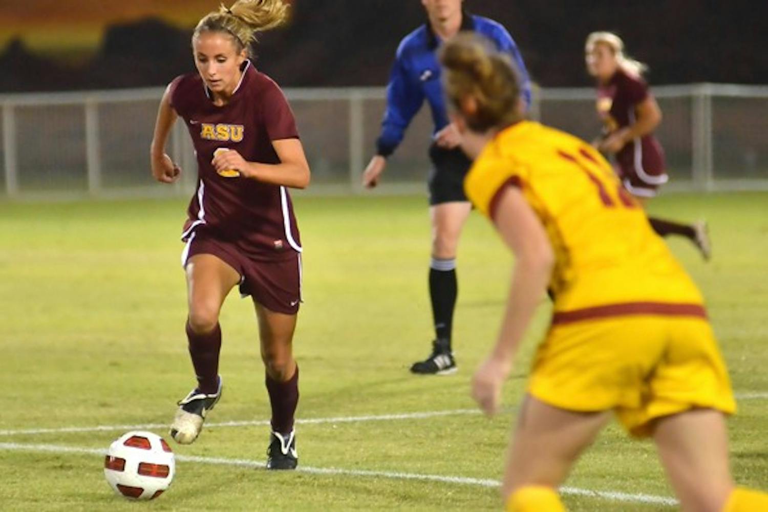 POSTSEASON POISE:Redshirt senior midfielder Lindsey Johns takes the ball up field against USC last Friday. The Sun Devils upset the Women of Troy to earn an NCAA Tournament bid and play UC Irvine on Friday in Califronia. (Photo by Aaron Lavinsky)