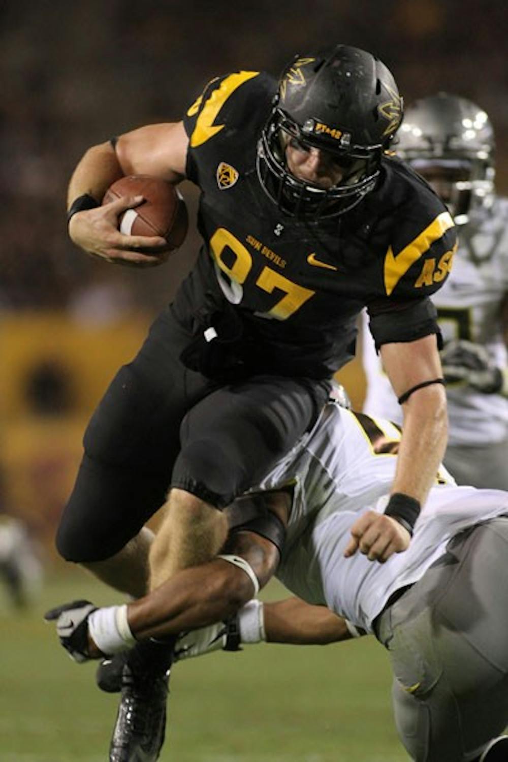 Junior tight end Chris Coyle fights through the Oregon defense during the Sun Devils’ 43-21 loss to the No. 4 Ducks on Oct. 18. (Photo by Sam Rosenbaum)