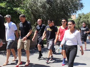 ASU ROTC recruits walk in high heels to promote awareness of sexual assault outside the Sun Devil Fitness Complex on Monday, April 20, 2015.