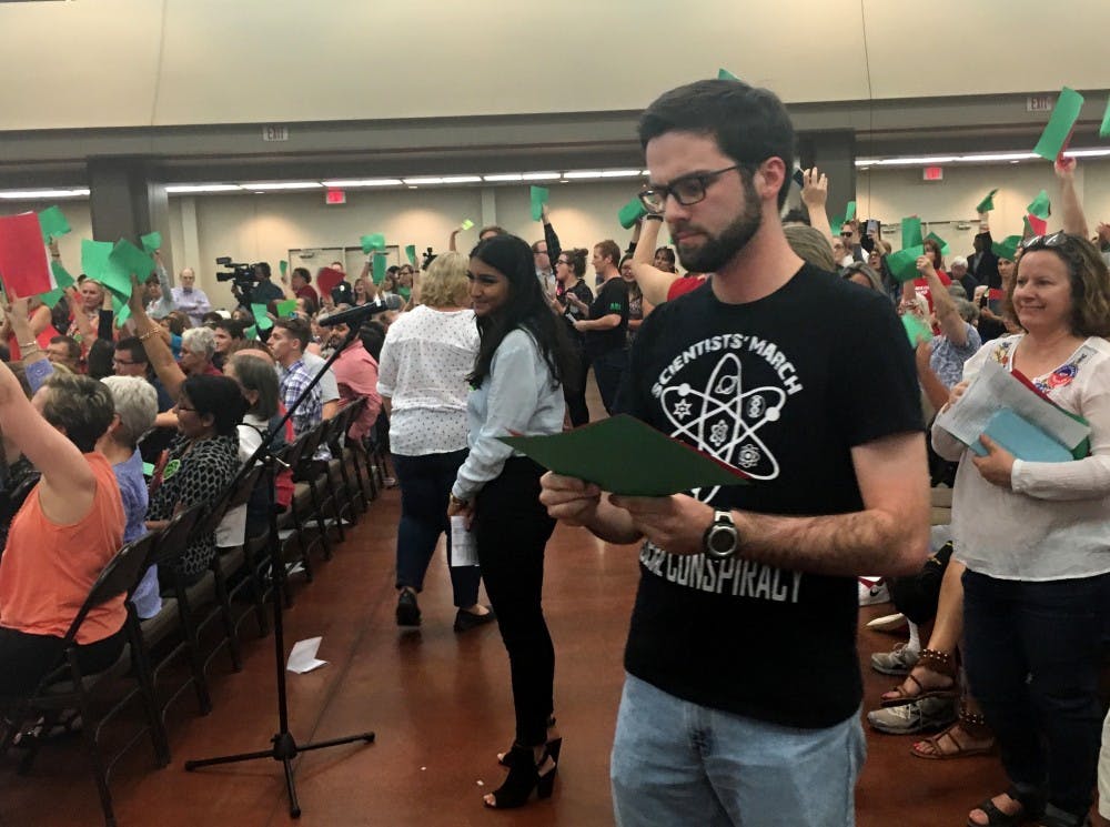 ASU Ph.D student John Christoph reviews his question before speaking at Jeff Flake's town hall meeting in Mesa, Arizona&nbsp;on Thursday, April 13, 2017.