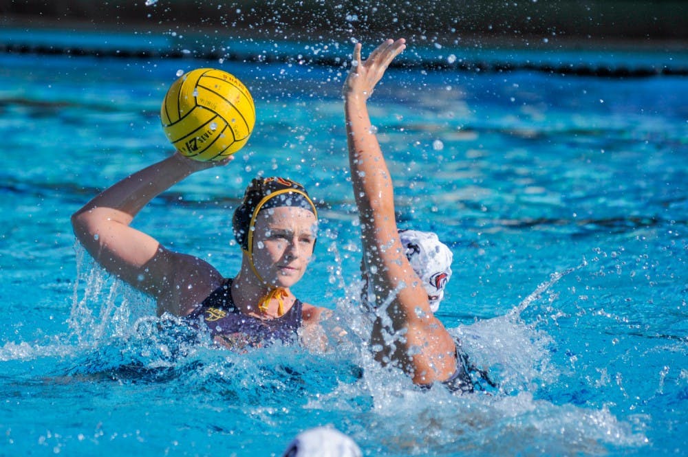 Senior Katie Sverchek looks for the pass in a match against UofP Sunday, March 20, 2016, at the Mona Plummer Aquatic Complex in Tempe, AZ.