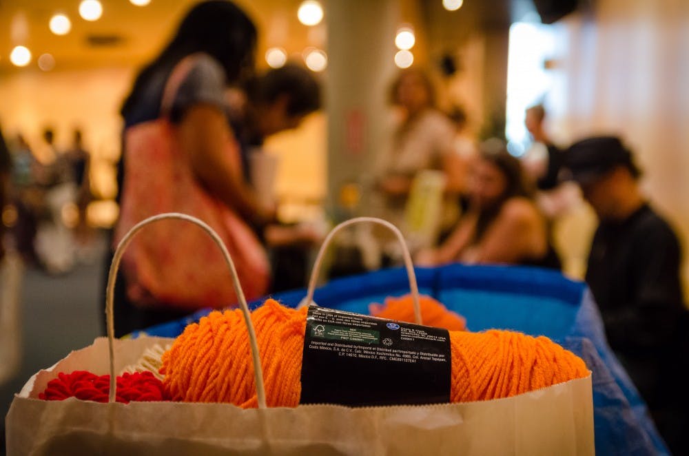 Materials for the Ground Cover art project are assembled in downtown Pheonix. For those volunteers assembling blankets, donated materials are an essential part of completing the work necessary to create the piece. (Photo by Andrew Ybanez)