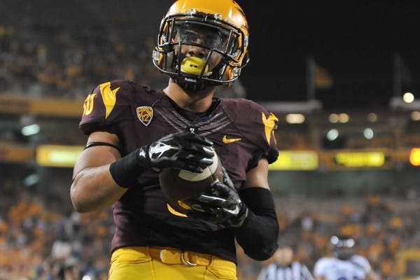 Junior running back D.J. Foster looks out at the crowd after making a 56 yard run for a touchdown against Weber State. ASU defeated Weber State 45-14 at Sun Devil Stadium on Aug. 28. (Photo by Andrew Ybanez)