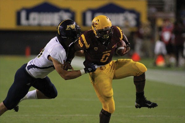Senior running back Cameron Marshall (right) shakes off an NAU tackler during the Sun Devils’ 63-6 win over the Lumberjacks on Aug. 30. (Photo by Sam Rosenbaum)