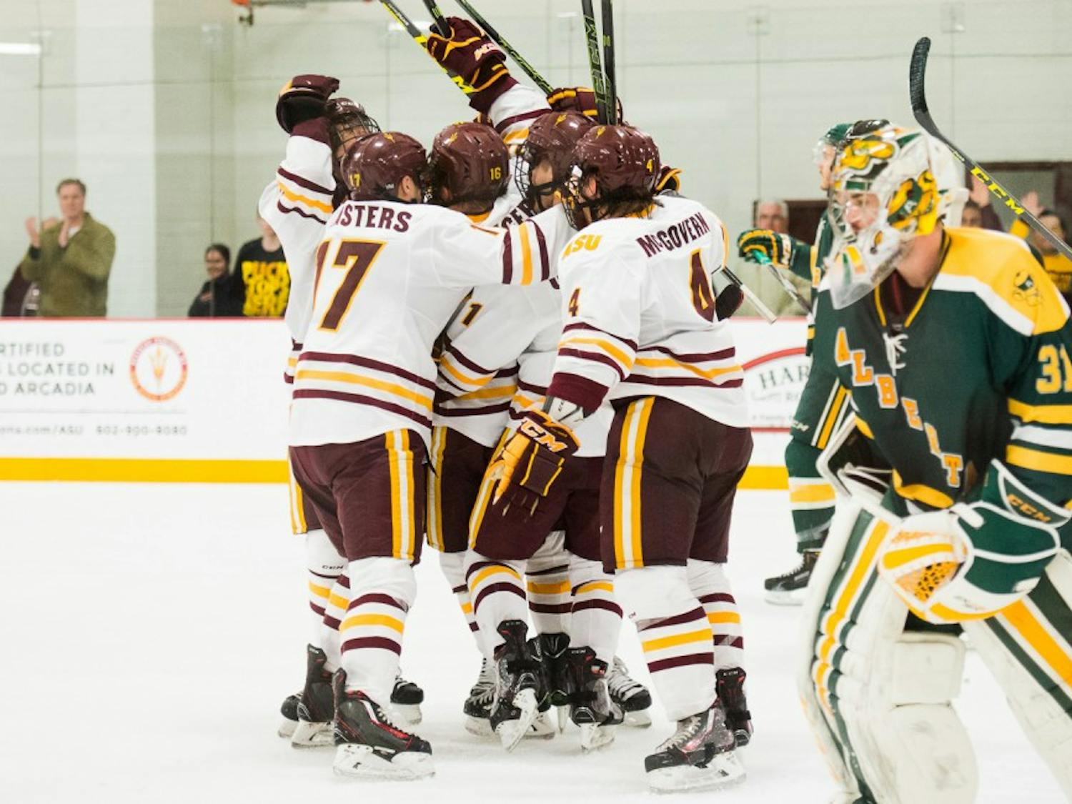 The ASU hockey team celebrates after a game-tying goal in overtime against the University of Alberta on Friday, Dec. 4, 2015, at Oceanside Ice Arena in Tempe. The Sun Devils defeated the Golden Bears 5-4 in a shootout.