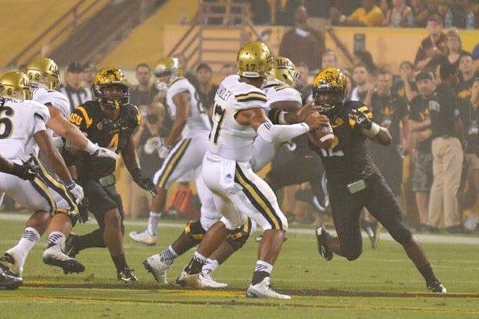 Redshirt senior De'Marieya Nelson rushes UCLA quarterback Brett Hundley in the second quarter of the Sun Devils' game against UCLA. (Photo by Andrew Ybanez)