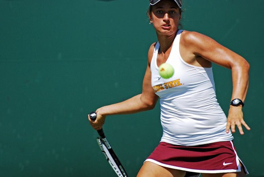 Senior Hannah James braces for a shot from a UCLA opponent on April 6. James and the ASU tennis team were shut out by USC on April 5.