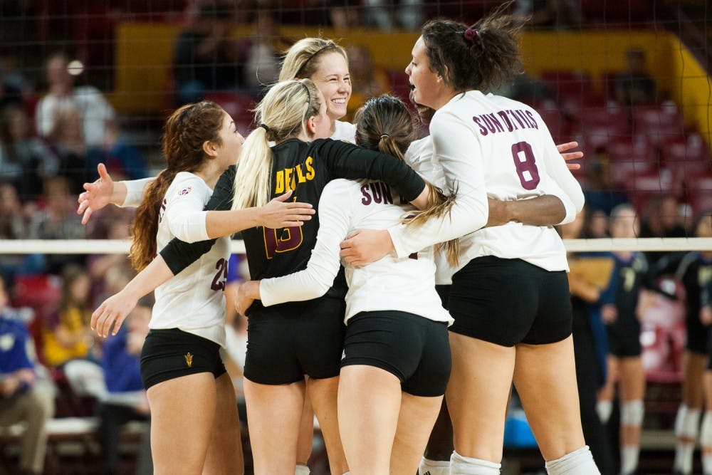 ASU's volleyball team regroups after winning a point against Washington on Friday, Nov. 6, 2015, at Sun Devil Stadium in Tempe. The Huskies swept the Sun Devils 3-0.