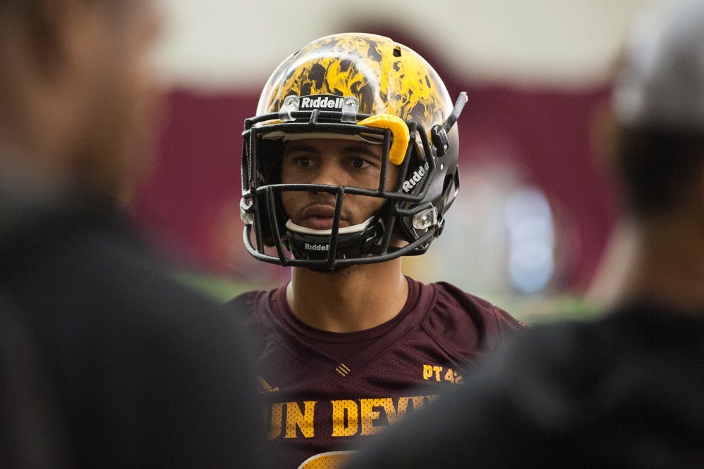 Senior running back D.J. Foster talks with teammates during ASU football practice on Thursday, Aug. 6, 2015, at the Verde Dickey Dome in Tempe.